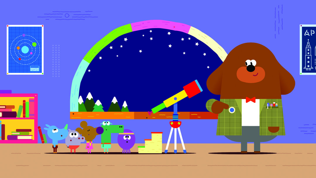 Duggee mit einem Button neben den Quirlies